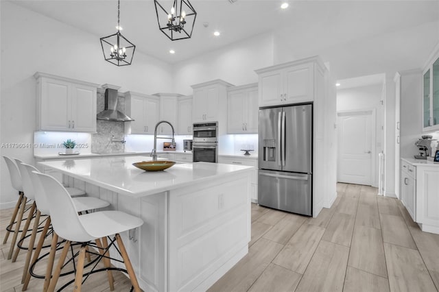 2623 Oakbrook Dr, Weston, FL 33332 - kitchen with stainless steel appliances, wall chimney exhaust hood, light countertops, backsplash, and white cabinetry