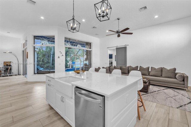 2623 Oakbrook Dr, Weston, FL 33332 - kitchen featuring stainless steel dishwasher, a chandelier, open floor plan, white cabinets, and recessed lighting