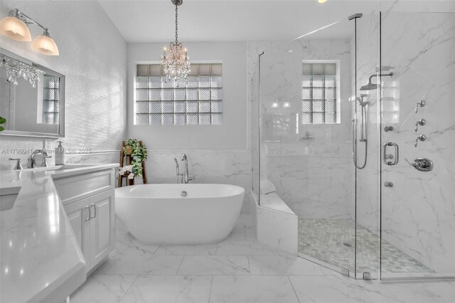 2623 Oakbrook Dr, Weston, FL 33332 - bathroom featuring a marble finish shower, a freestanding tub, vanity, a chandelier, and marble finish flooring