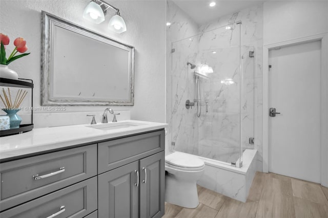 2623 Oakbrook Dr, Weston, FL 33332 - bathroom featuring a marble finish shower, vanity, and wood finished floors