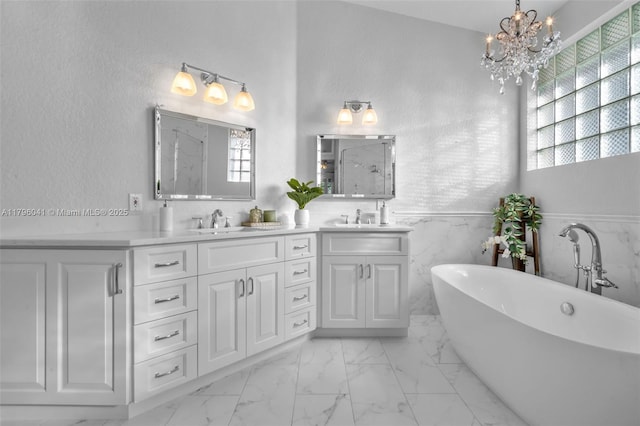 2623 Oakbrook Dr, Weston, FL 33332 - bathroom featuring a marble finish shower, a chandelier, marble finish flooring, double vanity, and a freestanding tub
