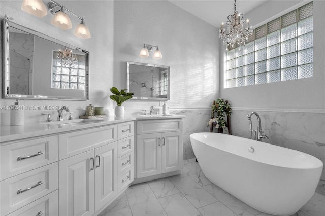 2623 Oakbrook Dr, Weston, FL 33332 - full bathroom featuring a chandelier, marble look tile flooring, a marble finish shower, double vanity, and a soaking tub