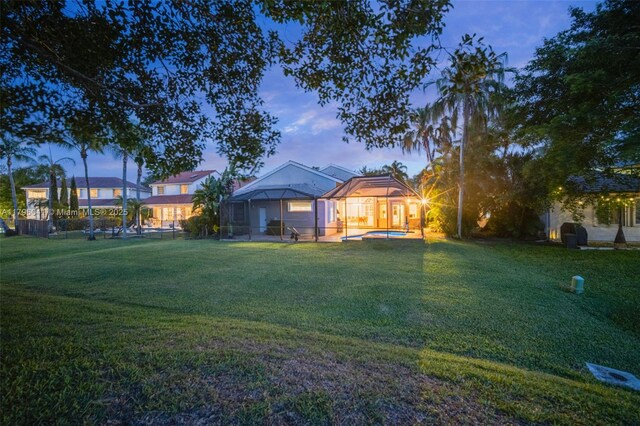 2623 Oakbrook Dr, Weston, FL 33332 - view of green lawn with a jacuzzi and glass enclosure