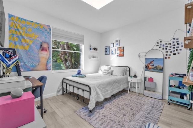 2623 Oakbrook Dr, Weston, FL 33332 - bedroom with a desk, wood finished floors, and baseboards