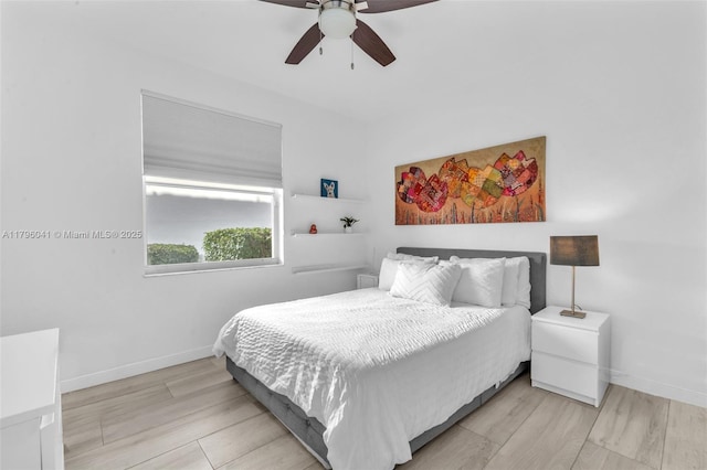 2623 Oakbrook Dr, Weston, FL 33332 - bedroom with baseboards, a ceiling fan, and light wood finished floors