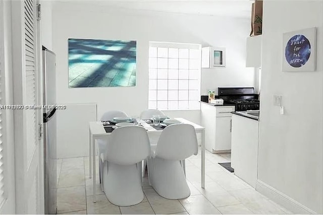 928 Jefferson Ave Unit 1, Miami Beach, FL 33139 - dining space featuring light tile patterned floors