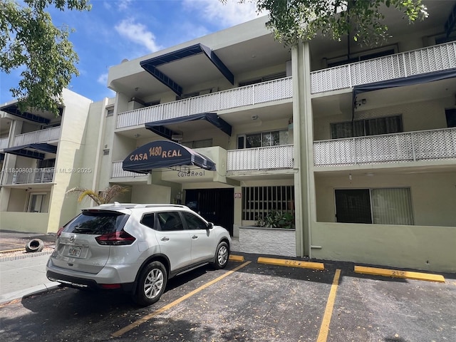view of property with uncovered parking