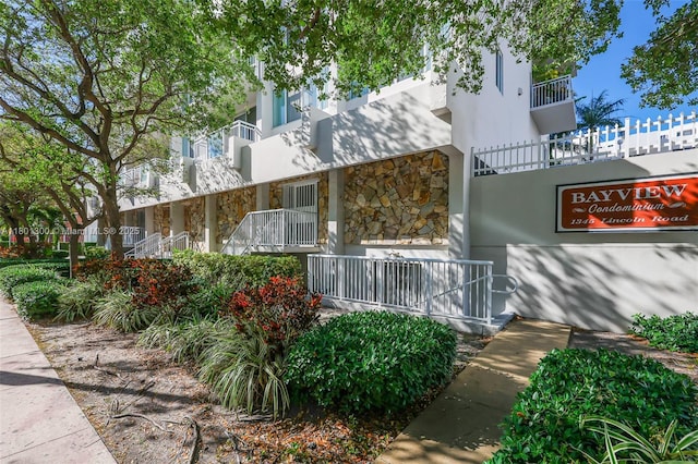 1345 Lincoln Unit 1006, Miami Beach, FL 33139 - view of side of property with stone siding and stucco siding