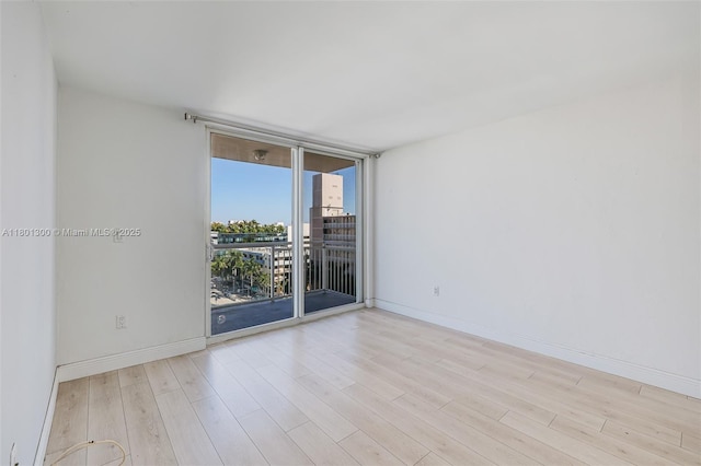 1345 Lincoln Unit 1006, Miami Beach, FL 33139 - unfurnished room featuring wood finished floors and baseboards