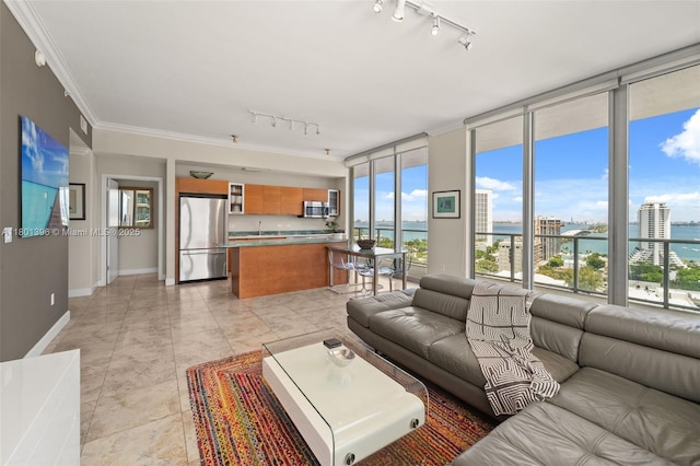 3470 E Coast Ave Unit H1909, Miami, FL 33137 - living area with track lighting, floor to ceiling windows, a water view, baseboards, and crown molding