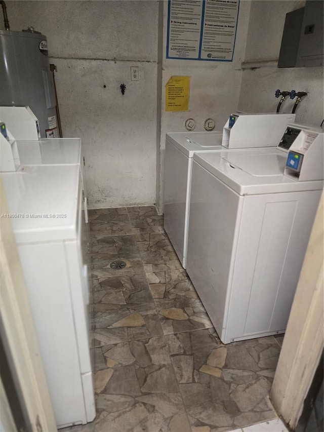 215 SE 3rd Ave Unit 401D, Hallandale Beach, FL 33009 - community laundry featuring washer and clothes dryer, electric water heater, stone finish floors, and electric panel