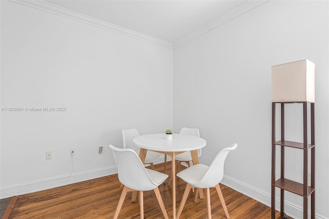 1555 Pennsylvania Ave Unit 209, Miami Beach, FL 33139 - dining room featuring wood finished floors, ornamental molding, and baseboards