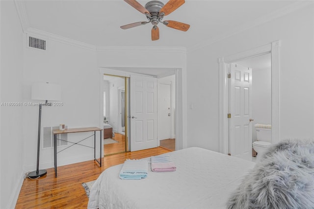 1555 Pennsylvania Ave Unit 209, Miami Beach, FL 33139 - bedroom featuring ornamental molding, wood finished floors, baseboards, connected bathroom, and a ceiling fan