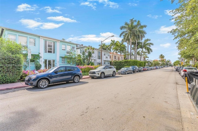 1555 Pennsylvania Ave Unit 209, Miami Beach, FL 33139 - view of asphalt road featuring street lights, a residential view, and sidewalks