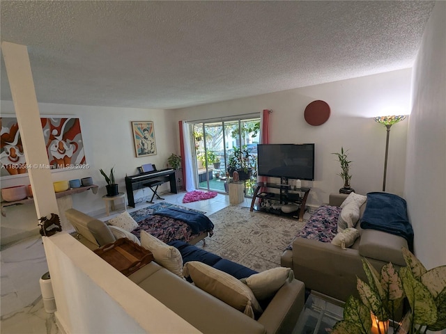 living area featuring a textured ceiling and marble finish flooring