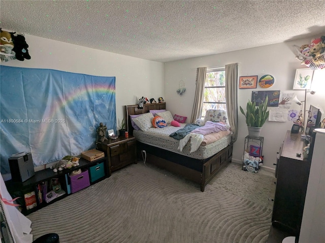 carpeted bedroom with a textured ceiling