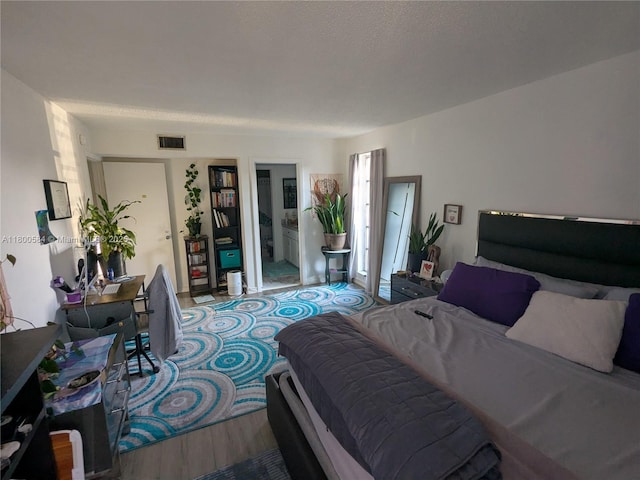 bedroom featuring wood finished floors