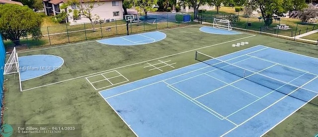 view of basketball court featuring community basketball court and fence