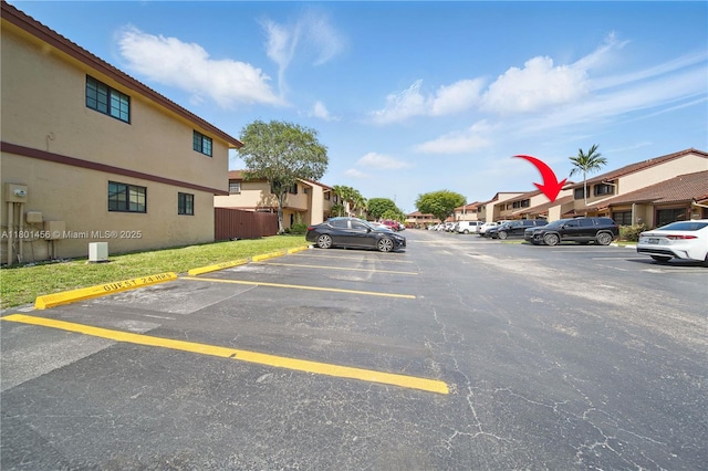 13344 SW 59th Ln, Miami, FL 33183 - uncovered parking lot with a residential view