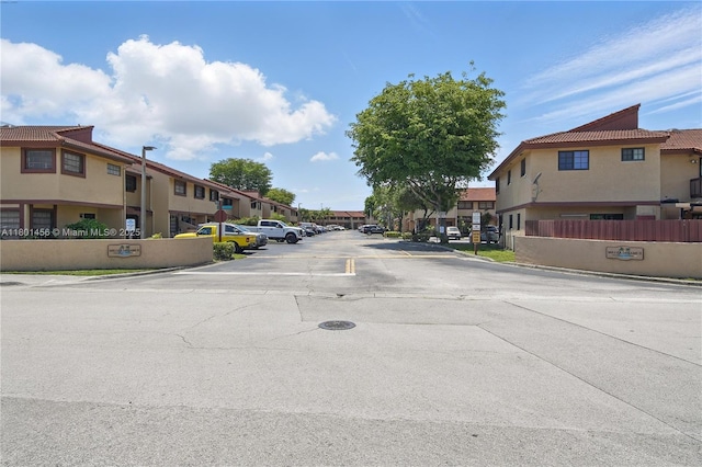 13344 SW 59th Ln, Miami, FL 33183 - view of asphalt road with a residential view, curbs, and street lighting