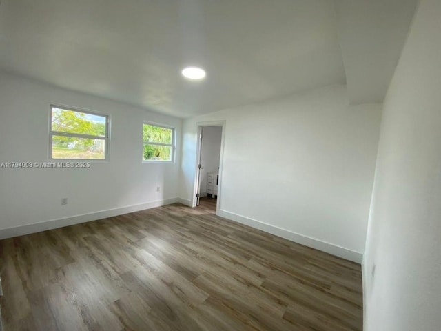 22011 Catherine Prt, Charlotte, FL 33952 - empty room with baseboards and wood finished floors