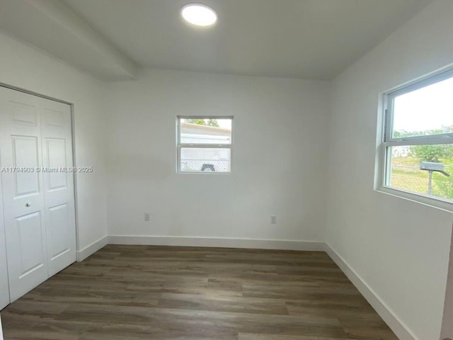 22011 Catherine Prt, Charlotte, FL 33952 - unfurnished bedroom featuring wood finished floors, baseboards, and a closet
