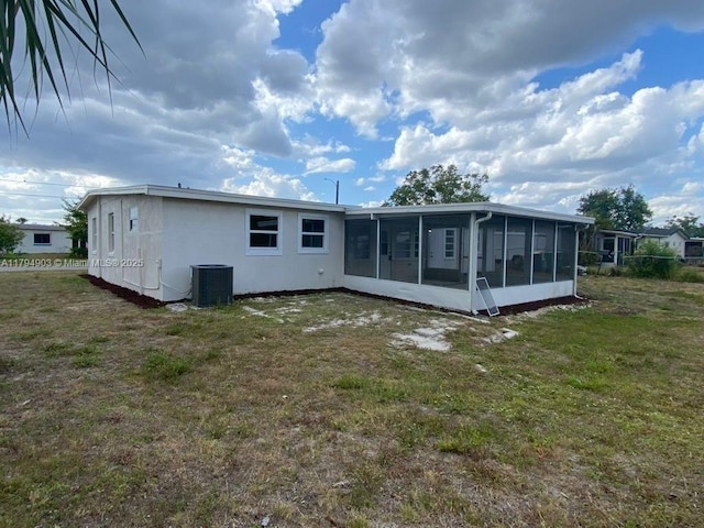 22011 Catherine Prt, Charlotte, FL 33952 - rear view of property with cooling unit, a sunroom, and a yard