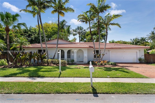 view of front of home with a garage, stucco siding, decorative driveway, and a tiled roof