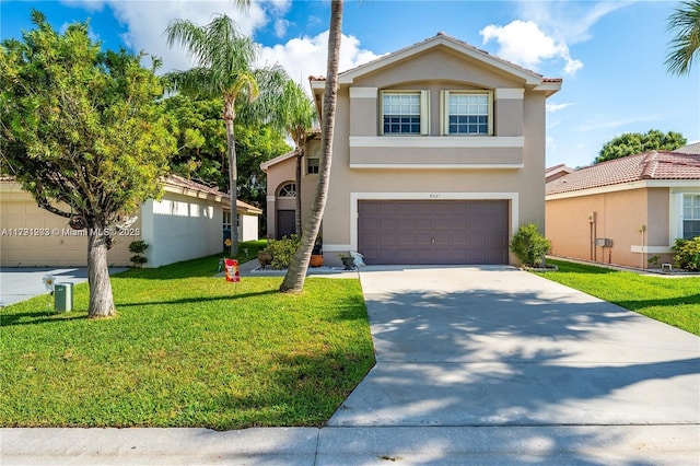 8021 Stirrup Cay Ct, Boynton Beach, FL 33436 - view of front of house featuring stucco siding, a front lawn, driveway, and a garage