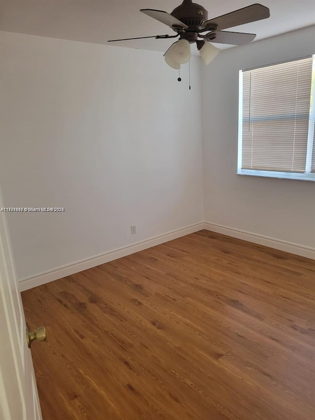 8021 Stirrup Cay Ct, Boynton Beach, FL 33436 - unfurnished room featuring wood finished floors, a ceiling fan, and baseboards