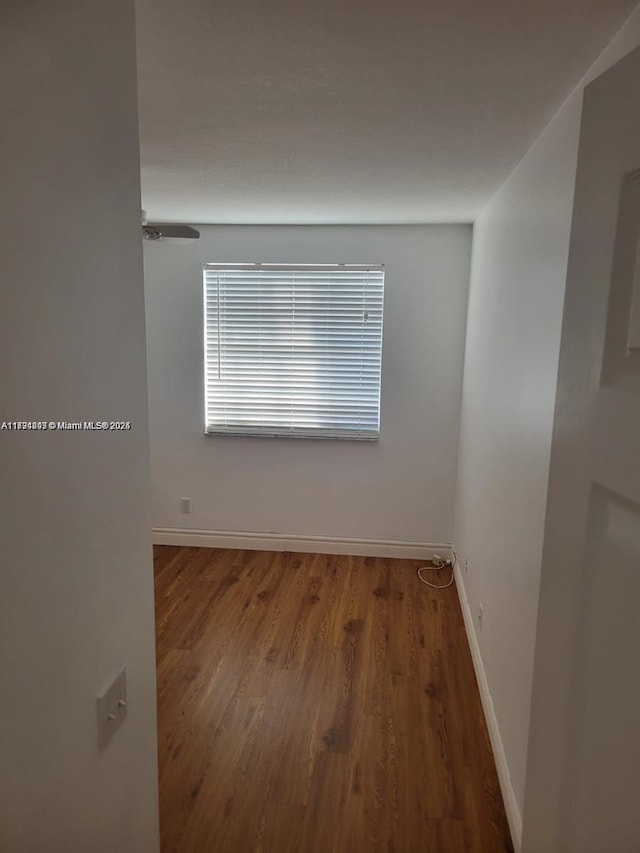 8021 Stirrup Cay Ct, Boynton Beach, FL 33436 - unfurnished room featuring baseboards and wood finished floors