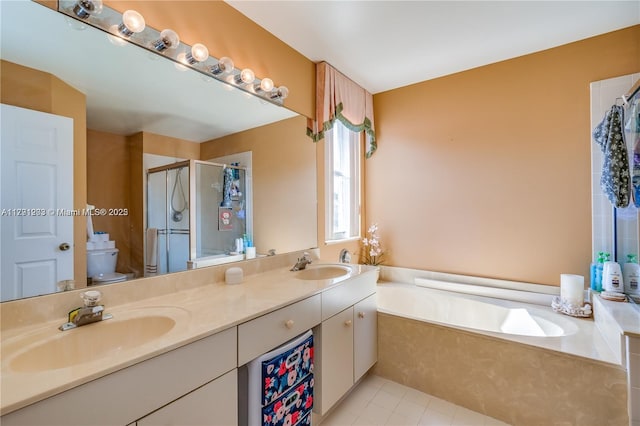 8021 Stirrup Cay Ct, Boynton Beach, FL 33436 - full bath featuring a shower stall, toilet, double vanity, a garden tub, and tile patterned floors
