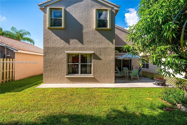 8021 Stirrup Cay Ct, Boynton Beach, FL 33436 - back of house with stucco siding, a patio, and an outdoor fire pit