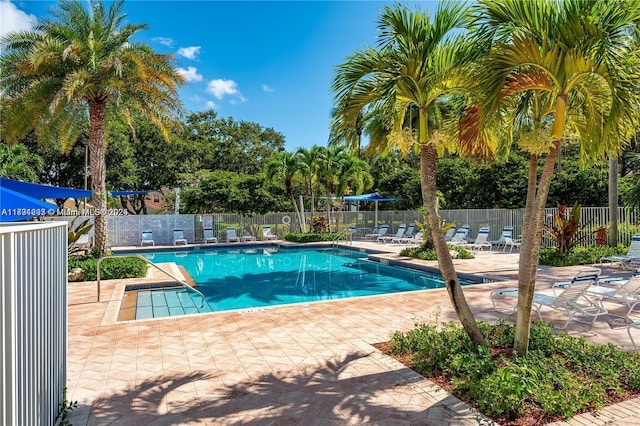 8021 Stirrup Cay Ct, Boynton Beach, FL 33436 - community pool featuring a patio and fence