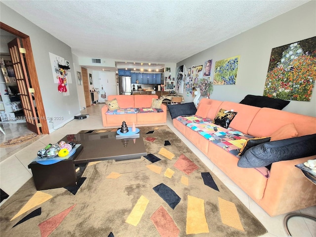 3800 S Ocean Dr Unit 818, Hollywood, FL 33019 - living room featuring a textured ceiling and light tile patterned flooring