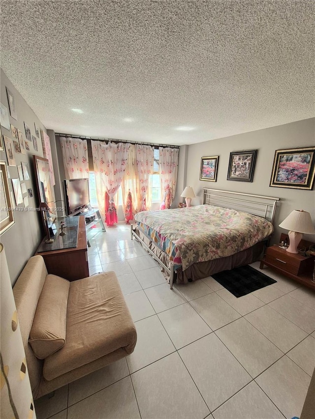3800 S Ocean Dr Unit 818, Hollywood, FL 33019 - bedroom with a textured ceiling and light tile patterned floors