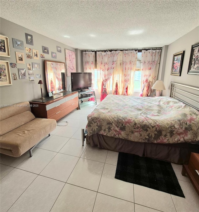 3800 S Ocean Dr Unit 818, Hollywood, FL 33019 - bedroom featuring a textured ceiling and light tile patterned flooring