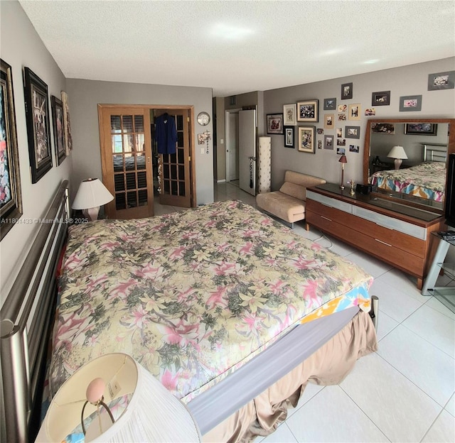 3800 S Ocean Dr Unit 818, Hollywood, FL 33019 - bedroom featuring a textured ceiling and light tile patterned floors