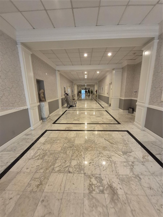 3800 S Ocean Dr Unit 818, Hollywood, FL 33019 - hallway featuring wainscoting, crown molding, inlaid floor details, marble finish floors, and recessed lighting