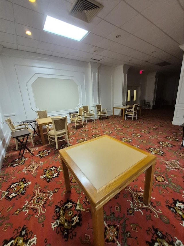 3800 S Ocean Dr Unit 818, Hollywood, FL 33019 - recreation room with carpet flooring, a decorative wall, a paneled ceiling, and recessed lighting