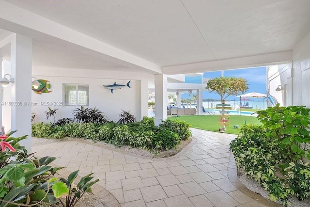 view of patio / terrace featuring a water view