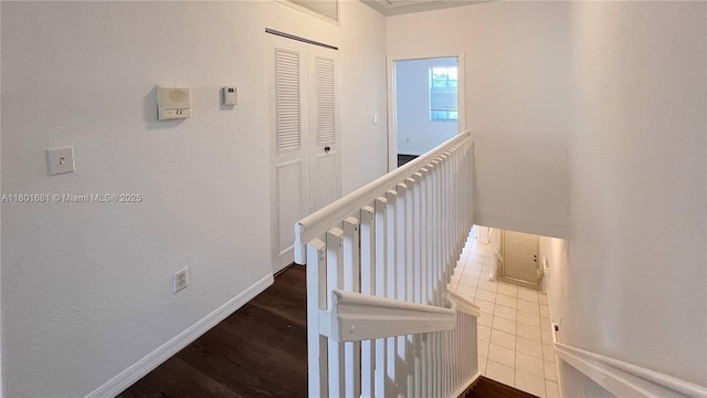 781 SW 148th Ave Unit 1513, Sunrise, FL 33325 - staircase featuring baseboards, wood finished floors, and a textured wall