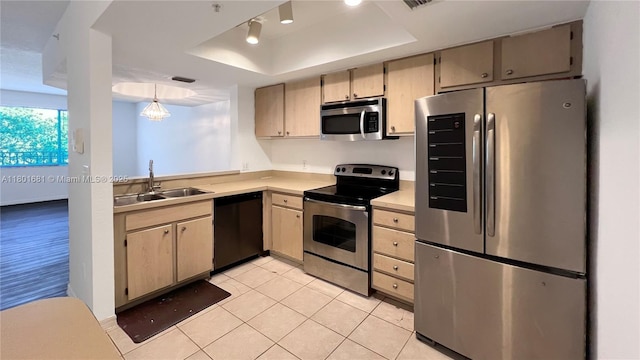 781 SW 148th Ave Unit 1513, Sunrise, FL 33325 - kitchen with appliances with stainless steel finishes, a tray ceiling, a sink, light countertops, and light tile patterned flooring