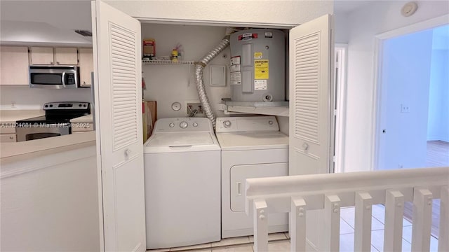 781 SW 148th Ave Unit 1513, Sunrise, FL 33325 - laundry area with electric water heater and washer and dryer