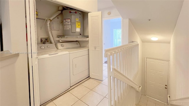 781 SW 148th Ave Unit 1513, Sunrise, FL 33325 - clothes washing area with light tile patterned flooring, washer and dryer, and electric water heater