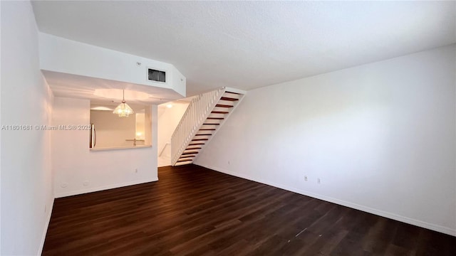 781 SW 148th Ave Unit 1513, Sunrise, FL 33325 - unfurnished room featuring stairway, dark wood finished floors, baseboards, and a chandelier