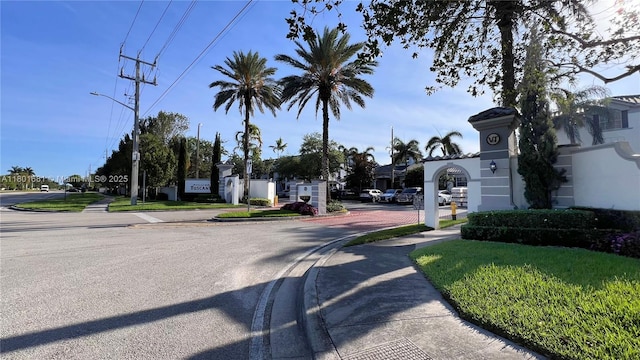 781 SW 148th Ave Unit 1513, Sunrise, FL 33325 - view of asphalt street featuring sidewalks, street lighting, and curbs