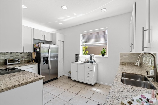 5832 NW 120th Ave, Coral Springs, FL 33076 - kitchen with stainless steel refrigerator with ice dispenser, a sink, tasteful backsplash, baseboards, and recessed lighting