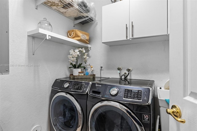 5832 NW 120th Ave, Coral Springs, FL 33076 - clothes washing area with washing machine and dryer, cabinet space, and a textured wall