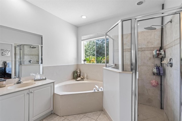 5832 NW 120th Ave, Coral Springs, FL 33076 - full bathroom featuring a shower stall, a garden tub, vanity, and tile patterned floors